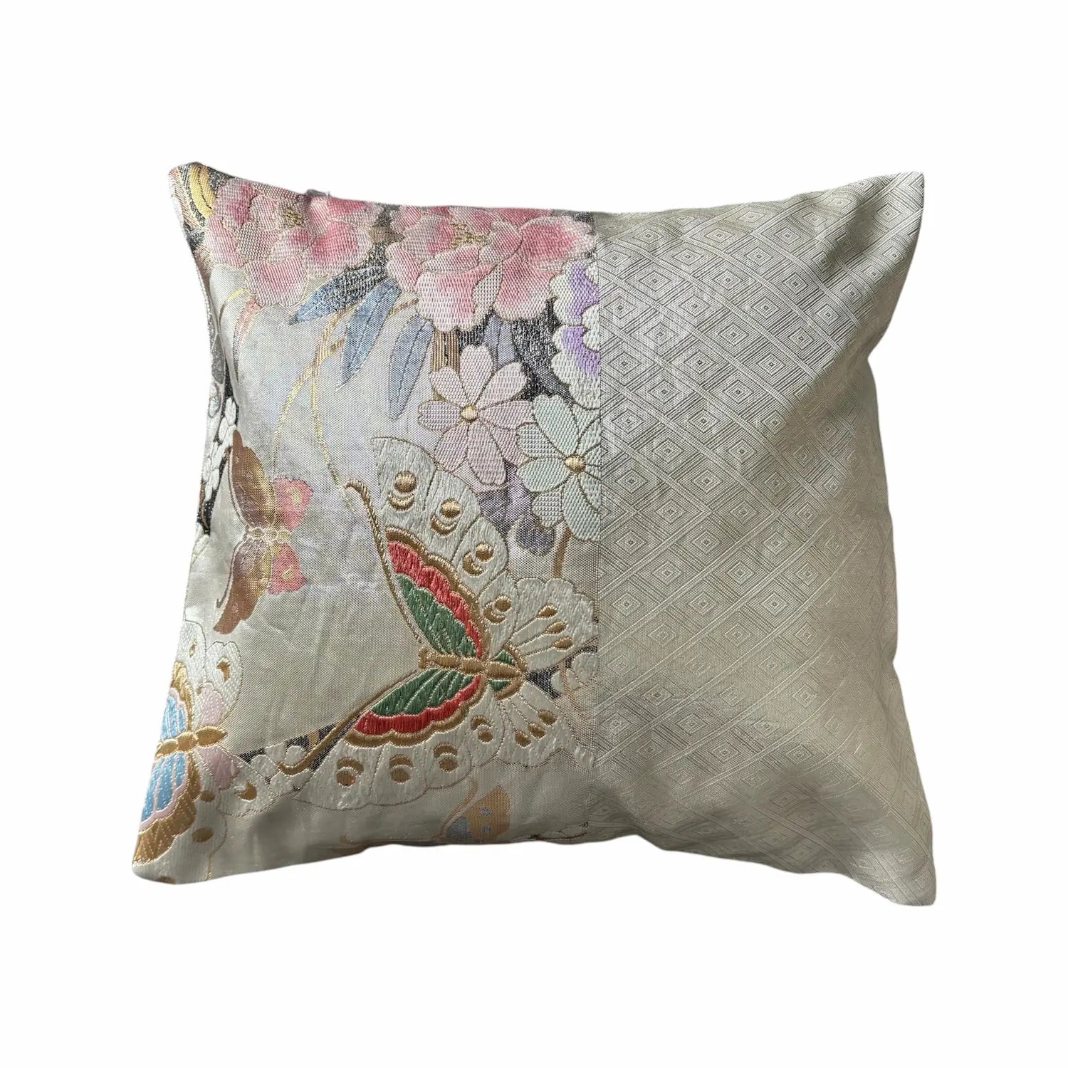 Decorative cushion with floral and butterfly pattern on a white background